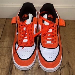 GUC nikes orange and black 11 Womens